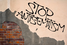 Stop Antisemitism - Handwritten Graffiti Sprayed On The Wall, Anarchist Aesthetics. Appeal To Fight Against Religious Prejudice, Hatred, Violent Attacks And Genocide