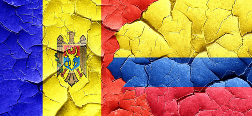 Moldova flag with Colombia flag on a grunge cracked wall