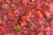 © Bert Folsom - Close view of chunky salsa sauce in natural light.