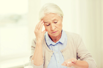 Sticker - senior woman with water and medicine at home