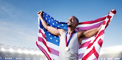 Sticker - Portrait of american sportsman is smiling for victory against large football stadium under bright blue sky