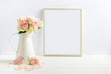 Mockup Styled Stock Photograph Of Cream Jug Of Flowers Next To A Gold Frame. You Can Place Your Business Promotion, Blog Title, Quote, Headline Or Image In The Frame.