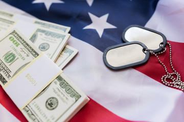 american flag, dollar money and military badges