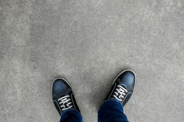 Wall Mural - Black casual shoes standing on concrete floor