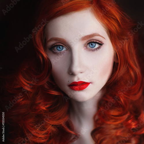 Portrait Of Red Haired Girl With Big Blue Eyes And Red Lips