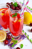 Fototapeta Kuchnia - Summer cold drink - lemonade with a cherry on a white background