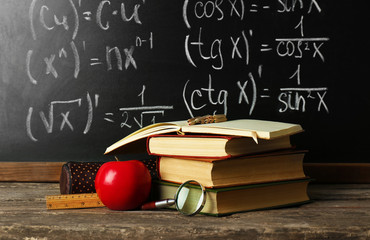 Poster - School books on desk near chalkboard