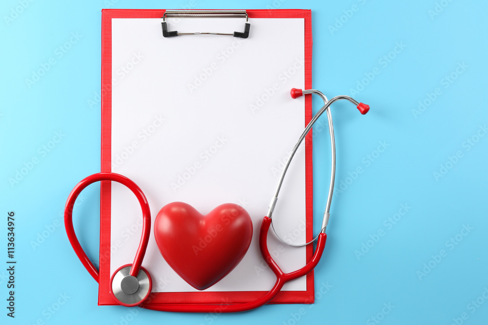 Red stethoscope with prescription on blue background