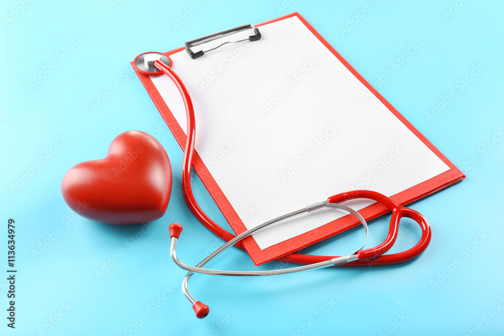 Red stethoscope with prescription on blue background