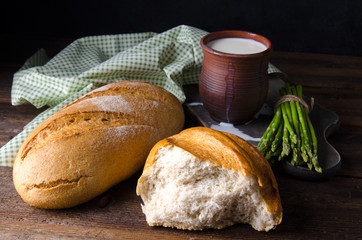 Wall Mural - torn, break rustic bread with milk