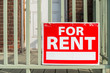 For rent sign posted in front of front porch