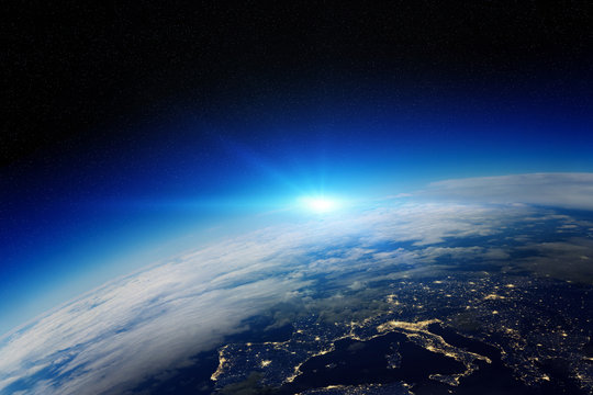 Sunrise over planet Earth in space