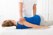 Masseur Doing Massage On Woman