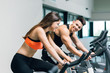 © Kike Arnaiz/ADDICTIVE STOCK - Couple practicing spinning at the gym