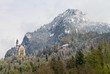 Castle in mountais, rocks and forest covered fresh snow
