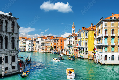 The Grand Canal with gondolas and boats. Colorful houses, Venice Poster