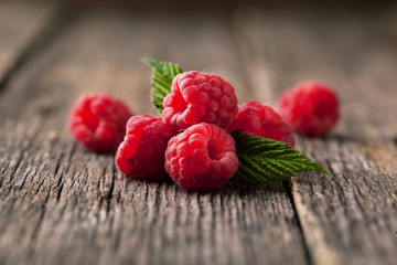 Poster - Ripe fresh raspberries with leaves