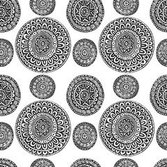 Seamless pattern of round ornaments in ethnic geometric style bl