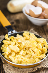 Wall Mural - Scrambled Eggs (selective focus) on wooden background