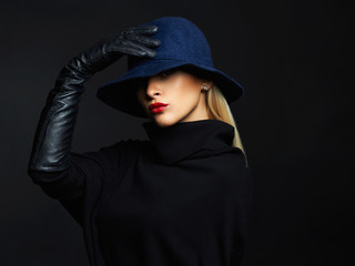 Wall Mural - Beautiful woman in hat and leather gloves. Retro fashion girl with red lips