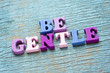 Be gentle phrase on vintage wooden background