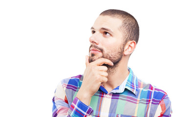 Wall Mural - Thinking man looks up with hand on the face, isolated on white b