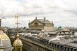 Panoramic view of Paris. Roofs of houses and the Opera Garnier.