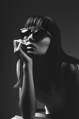 Portrait of a beautiful fashion model wearing sunglasses