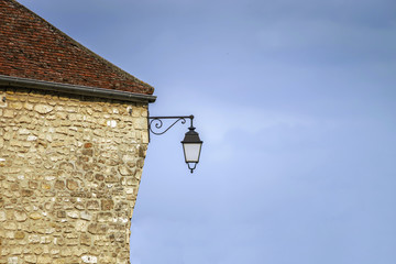 Wall Mural - Typical french village street with retro-style lanterns