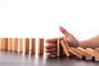 Stop domino risk effect ,businessman using hand for management s