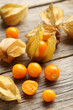 Ripe physalis on a grey wooden table