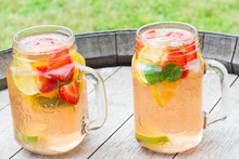 Homemade Strawberry Lemonade With Fresh Fruits, Served Outside.