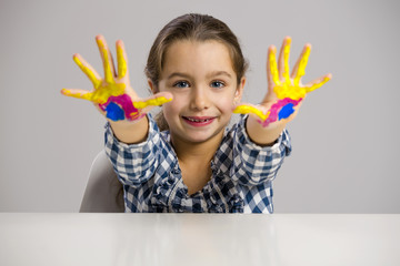 Wall Mural - Little girl with hands in paint