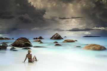 Wall Mural - woman resting on the beach