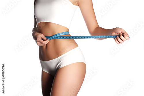 Fotografia Measure on woman body on white background