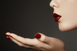 © looking2thesky - Beautiful young woman blowing a kiss from her hand