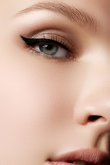 Cosmetics & make-up. Beautiful female eye with sexy black liner