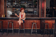 © Jacob Lund - Stylish young female sitting at a cafe with drink