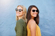 © Jacob Lund - Stylish female friends wearing sunglasses