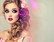 Summer  woman . Beautiful model with flower wreath on his head . Makeup smoky eyes . Summer girl with trendy makeup . 