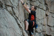 © antgor - Male rock climber clings to a cliff