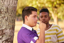 Group Of Teens Smokers Boy Smoking Electronic Cigarette