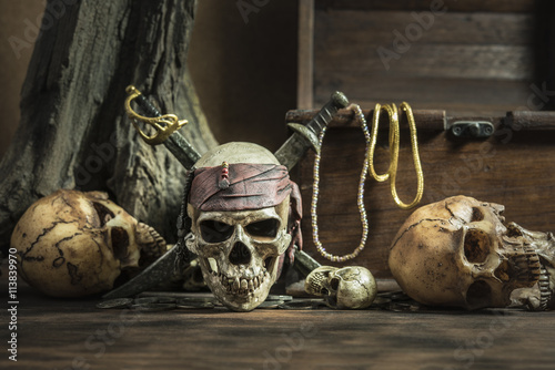 pirate skull with two swords and treasure coffer