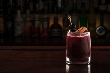 Wall Mural - Blackberry cocktail with cinnamon stick.