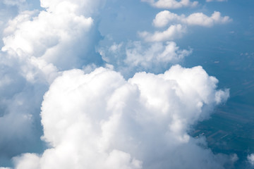 Wall Mural - aerial view of cloud and sky from airplane,traveling concept