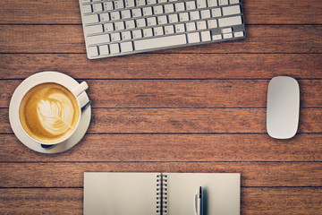 Wall Mural - Office table with notepad, computer and coffee cup and computer