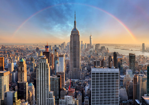 new york city skyline with urban skyscrapers and rainbow.