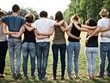© juripozzi - large group of friends together in a park having fun