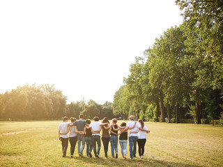 large group of friends together in a park having fun