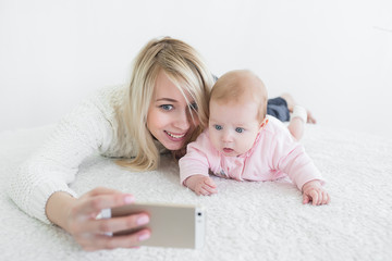 baby make selfie on mobile phone